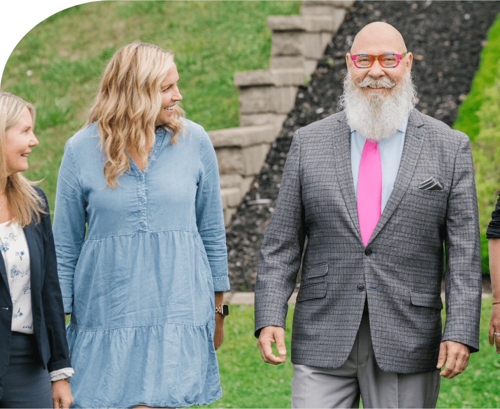 Volunteers walking infront of NCF Commemorative Garden