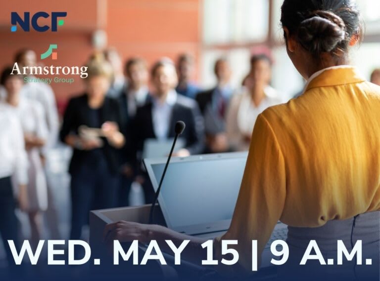 A person speaks at a podium.