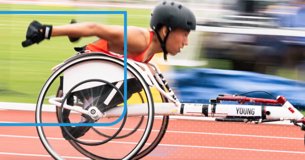 Person taking part in a wheelchair race.